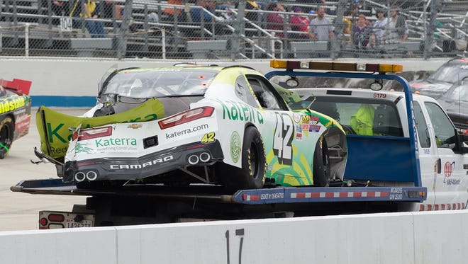 Justin Marks' car is hauled away after a wreck during the Drive Sober 200 presented by the Delaware Office of Highway Safety NASCAR Xfinity Series race at Dover International Speedway in Dover, Del.