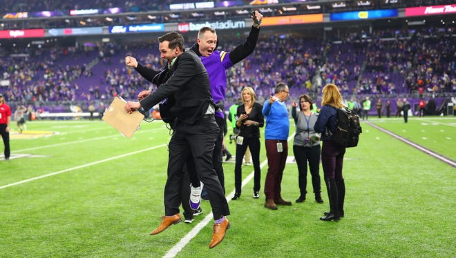 Former Firefly Music Festival head Greg Bostrom (left) and with DJ Skee celebrate the Minnesota Vikings' win over the New Orleans Saints on Jan. 14.