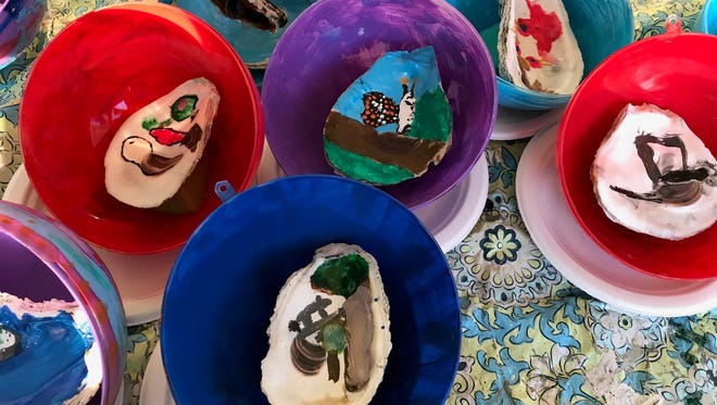 The painted oyster shells are glued to the other half of the shell and mounted inside brightly painted back halves of the clear globes that now hang on Maryland's tree along the Pathway of Peace surrounding the National Christmas Tree in Washington, D.C.
