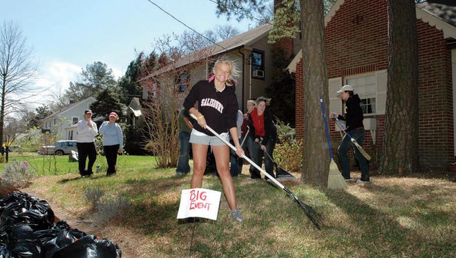 Salisbury University students help neighbors with yard work and other household tasks during the Big Event.