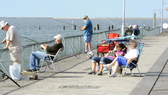 Fishermen and fishermen watchers enjoying a pleasant day at the Cape Henlopen state park fishing pier. The pier was closed in October after a structural inspection found an immediate need for repairs. The legislature is working on funding for improvements the Delaware's state parks.