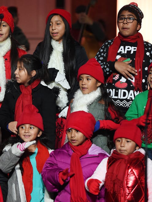 Children are dressed for the occasion at the Caroling on the Circle event.
