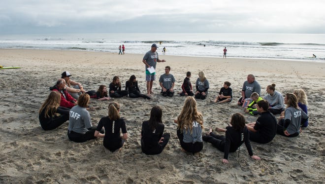 Instructor Tommy Vach, center, leads a group discussion in Ocean City on Sunday, Oct. 15, 2017.