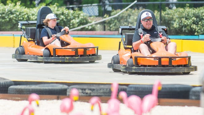 Jared Keefe races his dad Ed Keefe on the Miami Drift track at Jolly Roger Amusement Park in Ocean City on Monday, June 6.