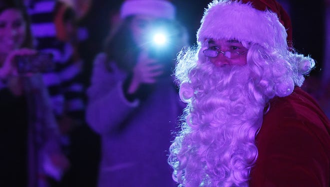 Santa comes for a visit during the annual Caroling on the Circle in Georgetown.