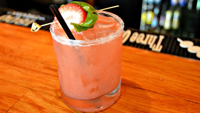 The strawbasil margarita from Rehoboth Ale House, made with tequila, fresh squeezed lime and strawberries, mint, homemade ginger simple syrup and a splash of soda water.