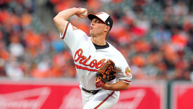 Baltimore Orioles pitcher Tyler Wilson throws a pitch in the eleventh inning against the Toronto Blue Jays at Oriole Park at Camden Yards.