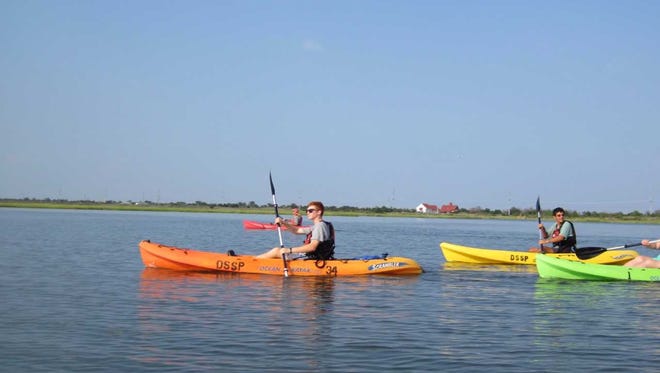 Kayakers paddle at Delaware Seashore State Park.