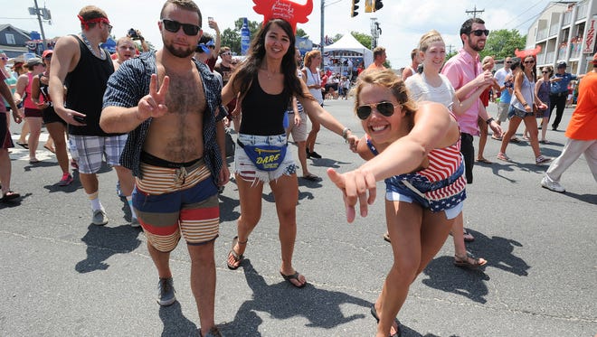 RUNNING OF THE BULL: Partiers turned out Saturday for the 19th annual Running of the Bull at the Starboard in Dewey Beach.