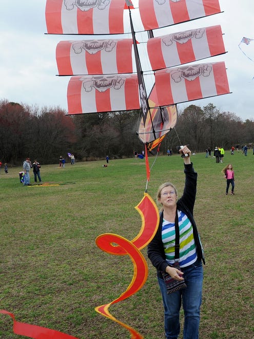 Nancy Forsyth from Lewes tries to get her pirate kite airborne as despite cloudy and rainy weather, the 48th Annual Kite Festival was held on Friday March 25th at Cape Henlopen State Park near Lewes with a good crowd on hand flying all kinds of kites and creations.