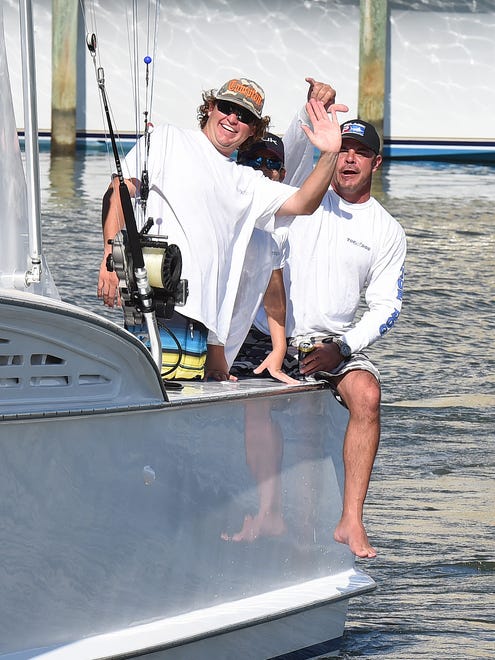 Crew of the "Top Dog" from Fenwick Island bring in the 1st White Marlin as Day 3 of the 44th Annual White Marlin Tournament in Ocean City brought in several of the sport fish for the Leader Board as 2 days of fishing remain.
Special to the Daily Times / Chuck Snyder