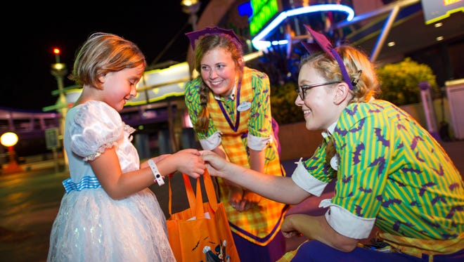 The park provides bags, and cast members are generous as they dole out fistfuls of candy treats.