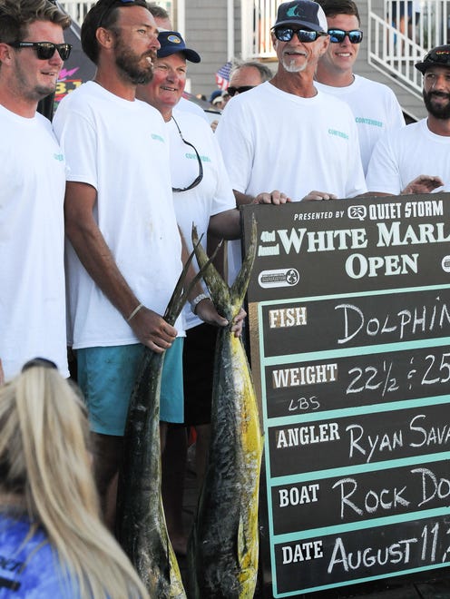 Rock Doc, of Selbyville, Del., brings in a 22.5 pound dolphin on the fourth day of the 43rd White Marlin Open.