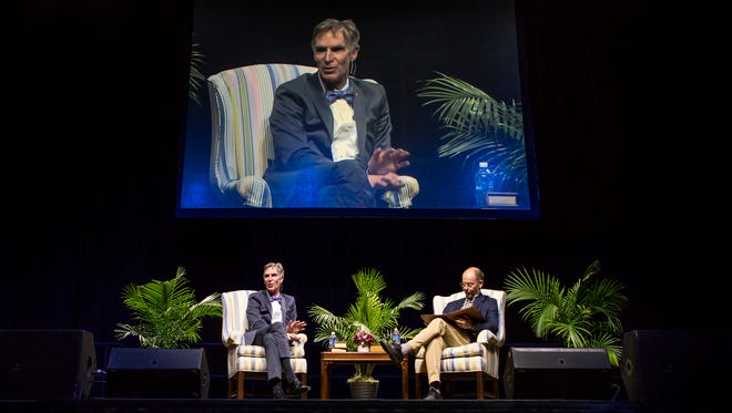 Bill Nye speaks during a moderated discussion with Univeristy of Delaware professor McKay Jenkins (right) at the Bob Carpenter Center in Newark on Tuesday night.