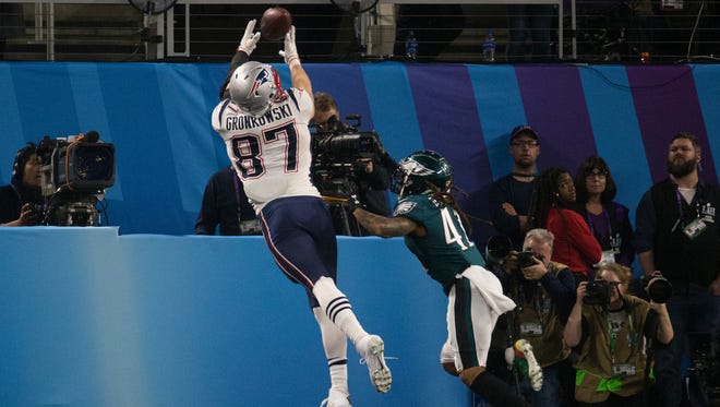 New England's Rob Gronkowski makes a reception for a touchdown despite the efforts of Philadelphia's Ronald Darby Sunday at US Bank Stadium.