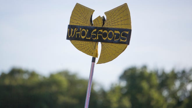 Signs, banners, and flags used by festival goers to keep their groups together at Firefly Music Festival in Dover.