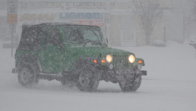 A green Jeep travels south on Coastal Highway in Bethany Beach on Saturday, Jan. 7, 2017.