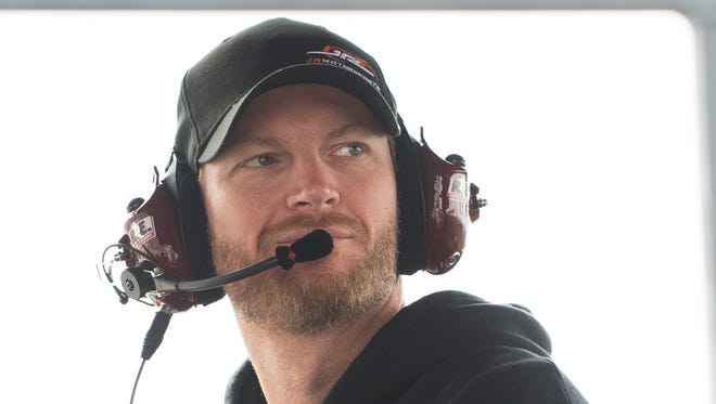 Dale Earnhardt Jr., listens on the radio during the Drive Sober 200 presented by the Delaware Office of Highway Safety NASCAR Xfinity Series race at Dover International Speedway in Dover, Del.