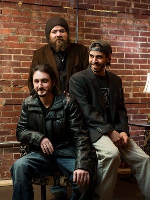 Members of the band Lower Case Blues Jake Banaszak, left, Paul Weik and BJ Muntz.