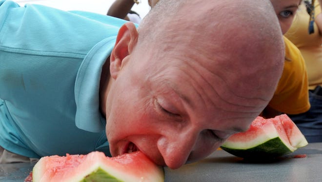 2014: Then-Governor Jack Markell racing to finish his slice in the watermelon eating contest. See more vintage images of the Delaware State Fair.