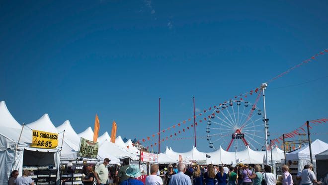 Visitors bustle about the Ocean City inlet as Sunfest kicks off Thursday, September 18.