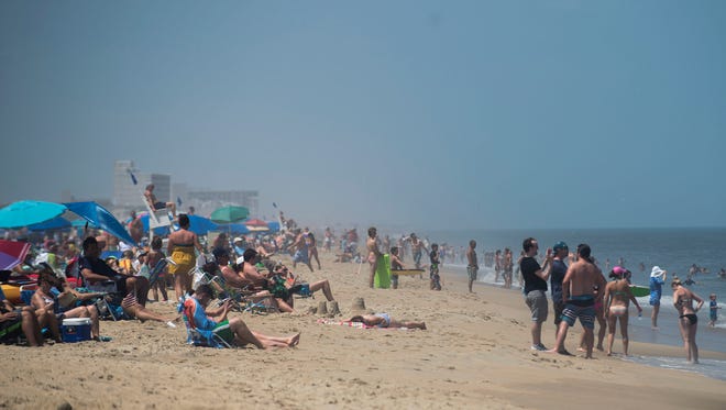 Beach goers in Dewey Beach enjoy the nice weather before tropical storm Arthur is expected to come through.