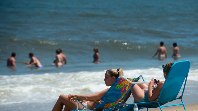 Beach goers in Dewey Beach enjoy the nice weather before tropical storm Arthur is expected to come through.