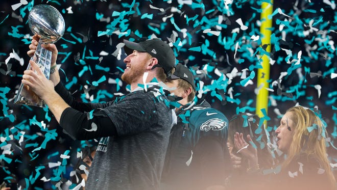 Eagles quarterback Carson Wentz celebrates winning Super Bowl LII Sunday at US Bank Stadium