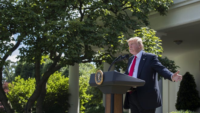 President Trump announces that the U.S. is withdrawing from the Paris climate accord during a Rose Garden event on June 1, 2017.