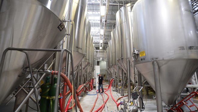 Fermentation tanks inside the Dogfish Head Brewery, located in Milton, Del., on Friday, July 14, 2017.