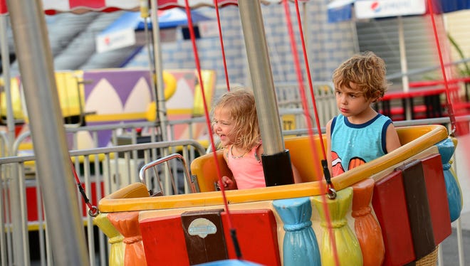 Georgia, 2, and Connor McGinnis, Hartford County enjoy the "Balloon Up Up and Away" ride at Trimper's Rides amusement park in Ocean City on Wed. Aug 31, 2016