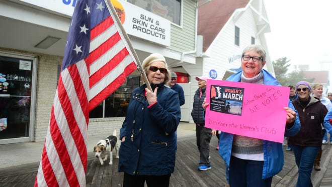 Members of The Democratic Women's Club of Worcester County's Women's lead the March Sister March on the boardwalk in Ocean City, Md. on Saturday, Jan 21, 2017.