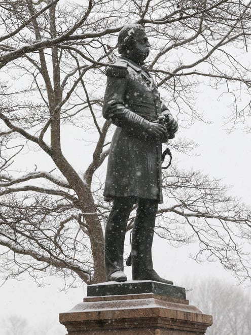 The Admiral Samuel Du Pont monument in Wilmington's Rockford Park is dotted with snowflakes as snow begins to drape the area Saturday morning.