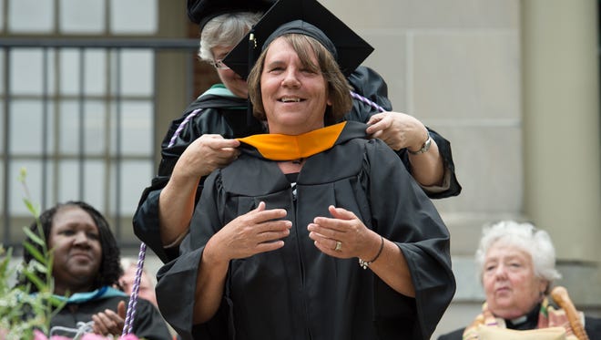 Janice Evans receives her master of science in nursing degree at the Wesley College Spring Commencement in Dover.  A total of 244 graduated.