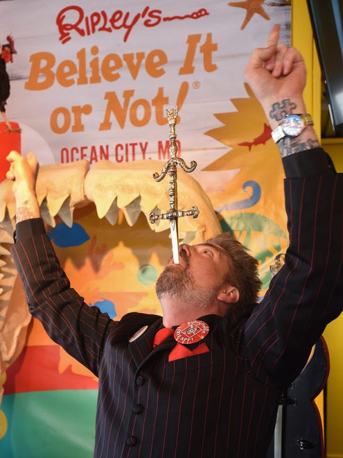 Sword swallower Tyler Fyre entertains the crowd at the Odditorium Grand Reopening of Ripley's Believe It or Not! on the Boardwalk in Ocean City Saturday, March 10, 2018.