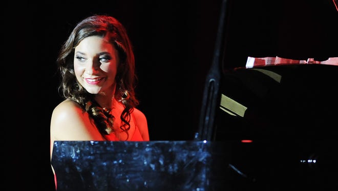 Miss Dewey Beach, Sophie Phillips plays the piano in the talent show as the 2017 Miss Delaware Pageant is held at Cape Henlopen High School in Lewes on Friday, June 16.