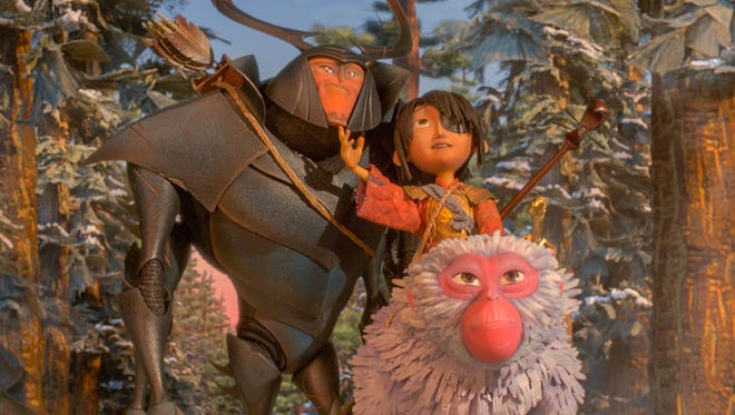 Beetle (voiced by Matthew McConaughey), Kubo (Art Parkinson) and Monkey (Charlize Theron) head off an epic quest in 'Kubo and the Two Strings.'