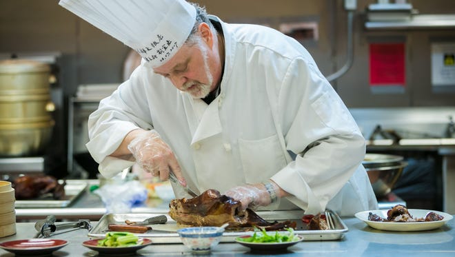 Henry Ward prepares a Peking duck dish. The Chinese American Community Center in North Star will be hosting its 25th Delaware Chinese Festival with a three-day celebration starting June 22.