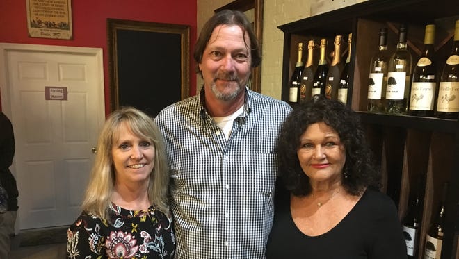 Donna Compher, left, owner of Sisters Mike and Deborah Everett, owners of the Maryland Wine Bar. The two former neighbors will now occupy the same space.