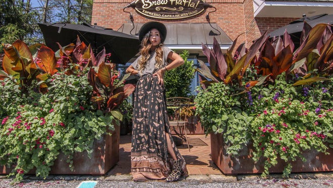 Dancer Rie Aoki wears a vintage found hat, Skyline Fever tee, Spell Byron Bay skirt, Urban Outfitters shoes and jewelry by Free people and Pure Vida Bracelets Sunday, July 2, 2017, at Brew HaHa! in Greenville.