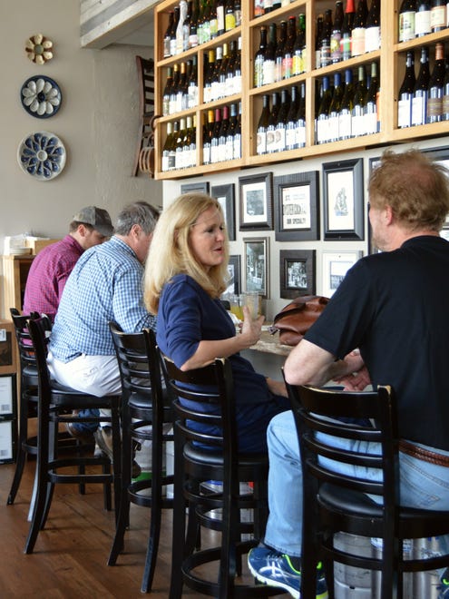 Diners enjoy happy hour at the Henlopen City Oyster House in Rehoboth Beach.