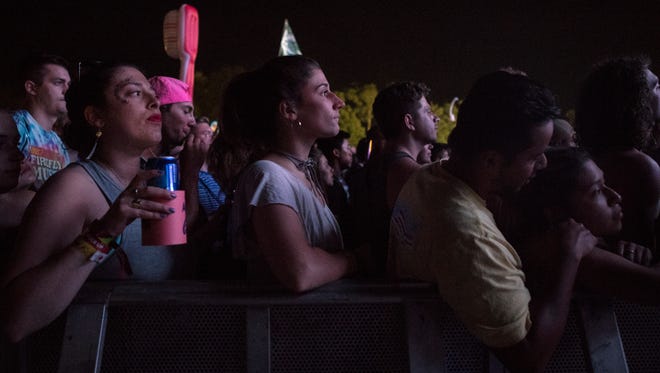 Festival goers enjoy the opening day performance by Chromeo at the Backyard Stage at the Firefly Music Festival in Dover.