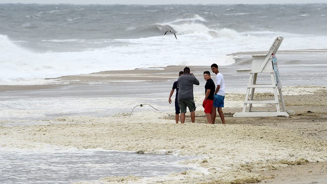Weather made for a lousy beach day at Rehoboth Beach  on Saturday, July 29, 2017, as wind-blown sand kept the crowds off the beach and high surf had the water closed by the beach patrol. Visitors took to walking on the boardwalk.