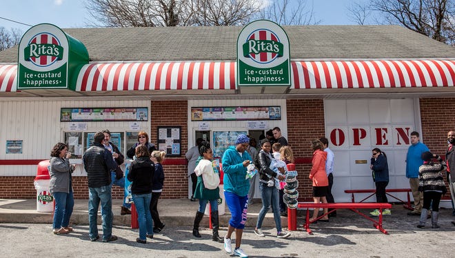 The traditional water ice giveaway at Rita's Italian Ice draws a crowd on the first day of spring each year.