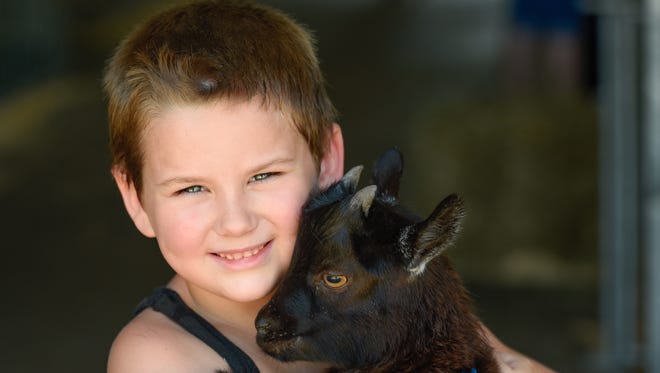 2015: JT Alphin, of Townsend, with his goat at the fair. See more vintage images of the Delaware State Fair.