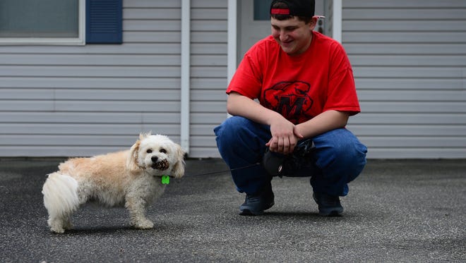 Joey Sweren and his dog Buddy take a walk on Satuday, April 22, 2017.