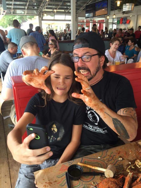Dave Grohl with Jackson Anderson, guitarist for Annapolis, Maryland-based rock band Fast as Lightning, on Saturday, Aug. 6. Grohl stopped by The Point Crab House in Arnold, Maryland on his way home from Rehoboth Beach.