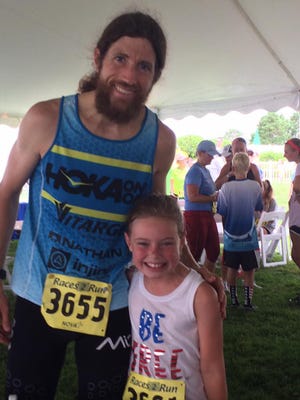 Michael Wardian poses with Maya Yngve at the Red White and Blue 5k in 2016 at the Delaware Tech campus in Georgetown.