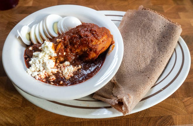 The Doro Wot: a spicy chicken stew, ayib cheese, hard-boiled egg, and injera, at Doro Bet in Philadelphia on Wednesday, Dec. 20, 2023.