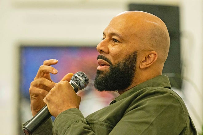 Common, rapper, actor, writer and activist, speaks during a book talk and signing event for his book And Then We Rise: A Guide to Loving and Taking Care of Self at the Wilmington Public Library on Friday, Jan 26, 2024. A capacity crowd of approximately 350 people attended.